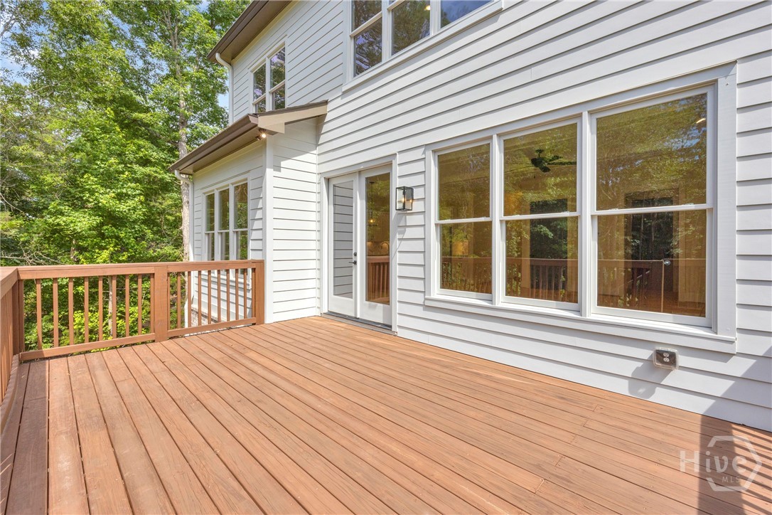 2476 St Martin Way Monroe, GA 30656 - Photo 67 of 75 Spacious exterior deck with wood-finish flooring and matching wood railing