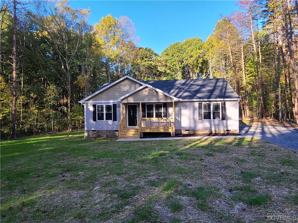 363 Hawkins Farm Road Bumpass, VA 23024 - Photo 1 of 9 a front view of a house with a garden