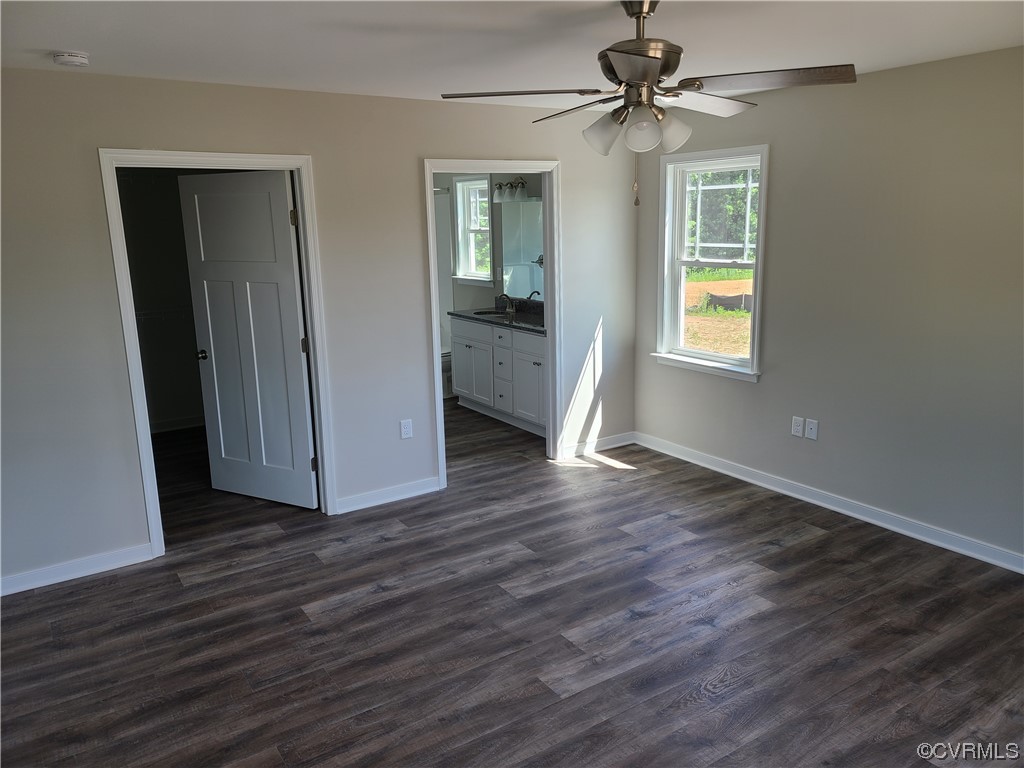 363 Hawkins Farm Road Bumpass, VA 23024 - Photo 7 of 9 wooden floor in an empty room with a window