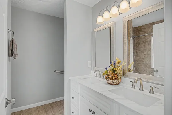 a bathroom with a sink and a mirror
