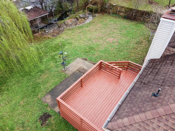 a view of a backyard with sitting area
