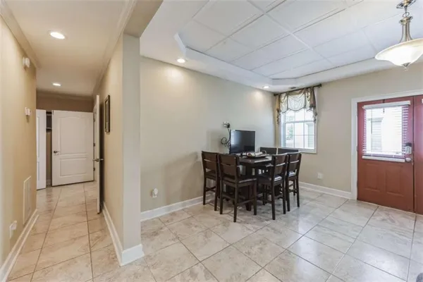 a view of a dining room with furniture and window