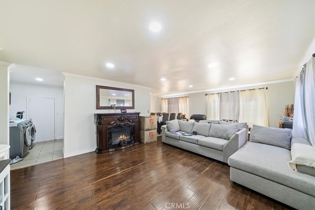 250 North Linden Avenue, Unit 327 Rialto, CA 92376 - Photo 12 of 27 a living room with furniture and a fireplace