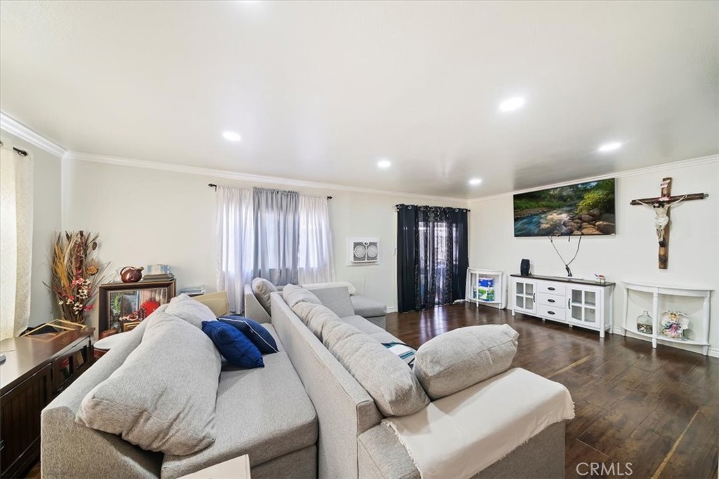 250 North Linden Avenue, Unit 327 Rialto, CA 92376 - Photo 13 of 27 a living room with furniture and a flat screen tv