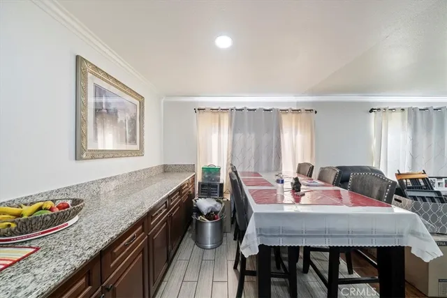 a view of a dining room with furniture and window