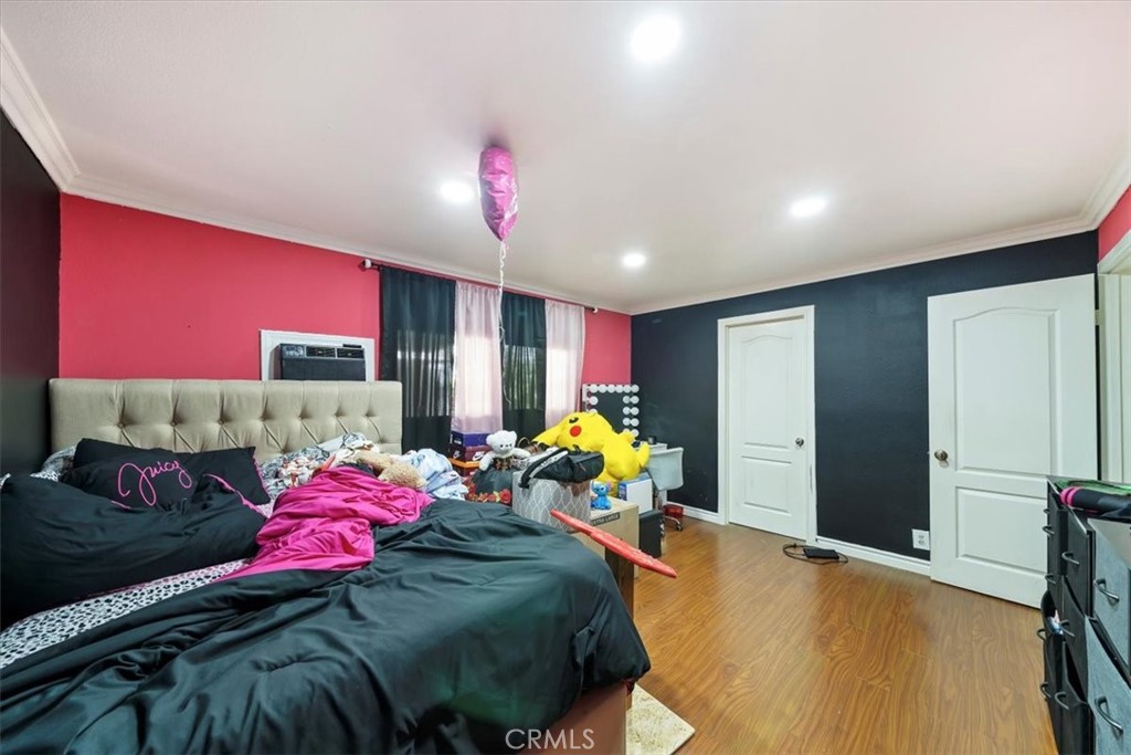 250 North Linden Avenue, Unit 327 Rialto, CA 92376 - Photo 19 of 27 a bedroom with a bed and a closet