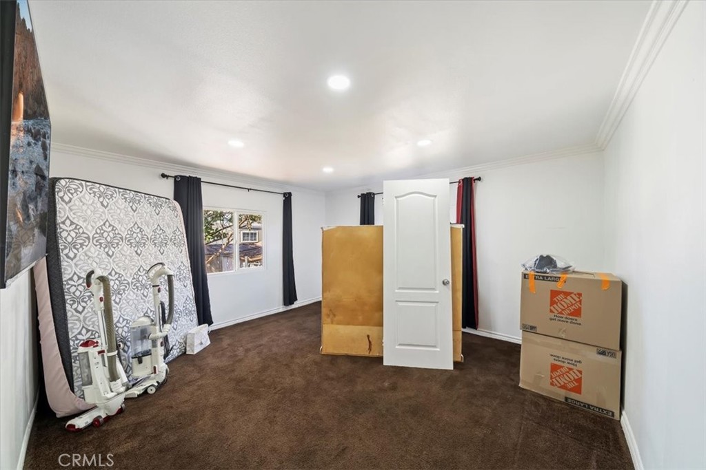 250 North Linden Avenue, Unit 327 Rialto, CA 92376 - Photo 25 of 27 a view of a livingroom with storage & utility room