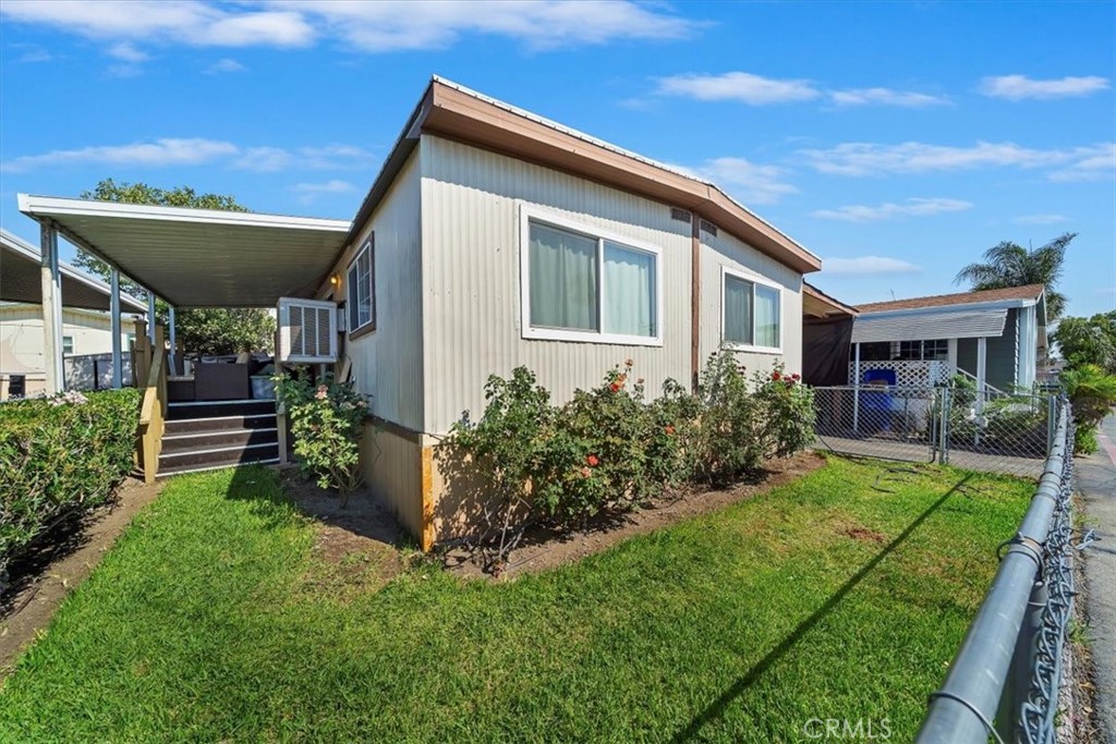 250 North Linden Avenue, Unit 327 Rialto, CA 92376 - Photo 4 of 27 a front view of house with a garden