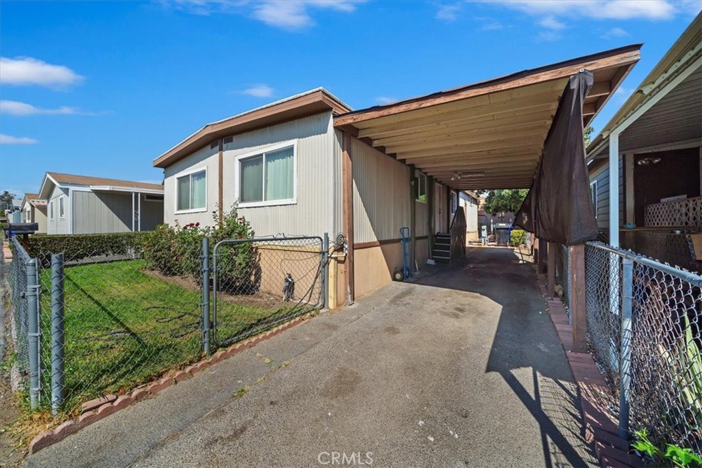 250 North Linden Avenue, Unit 327 Rialto, CA 92376 - Photo 5 of 27 a view of a house with backyard and porch