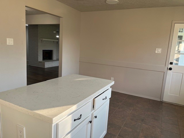 467 Buoy Road Webster, TX 77598 - Photo 5 of 23 kitchen island w quartz counter and cabinets. View of breakfast area
