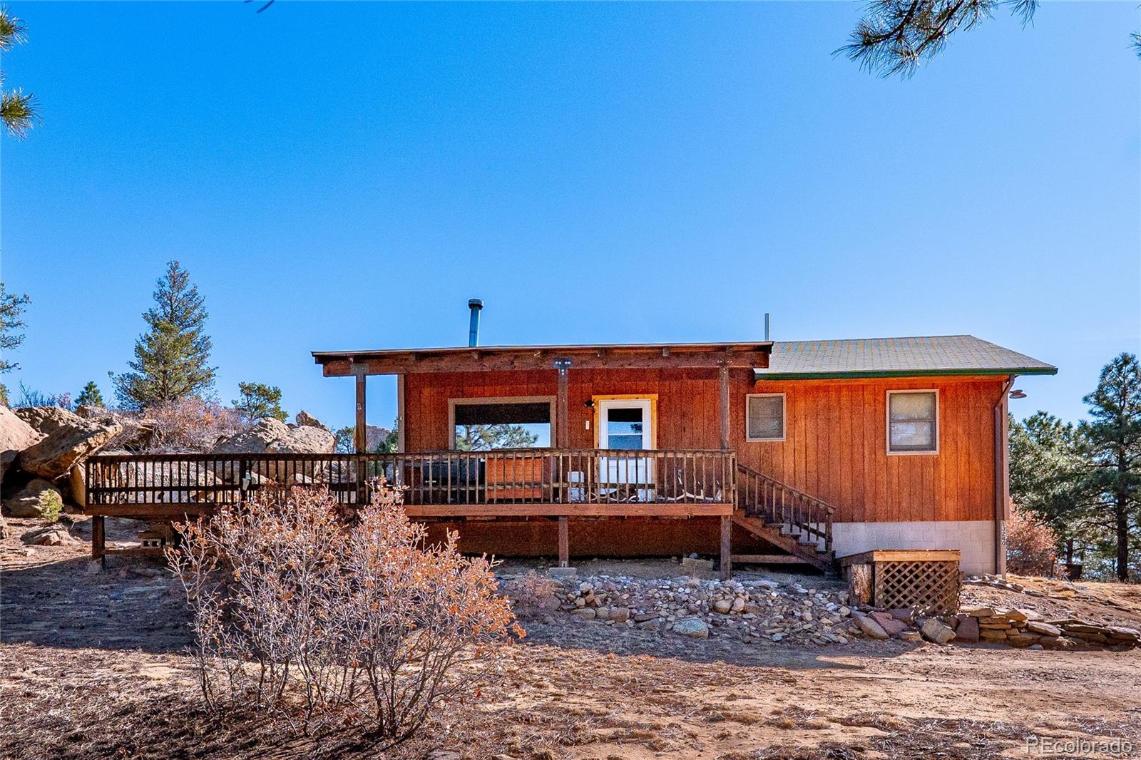 13240 Big Pine Ridge Road Weston, CO 81091 - Photo 1 of 49 a front view of a house with patio