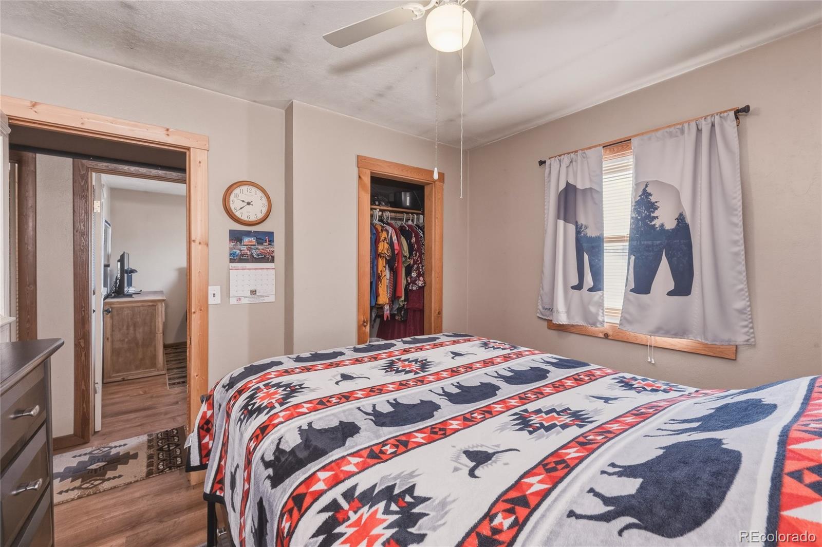 13240 Big Pine Ridge Road Weston, CO 81091 - Photo 12 of 49 a bedroom with a bed and a painting on the wall