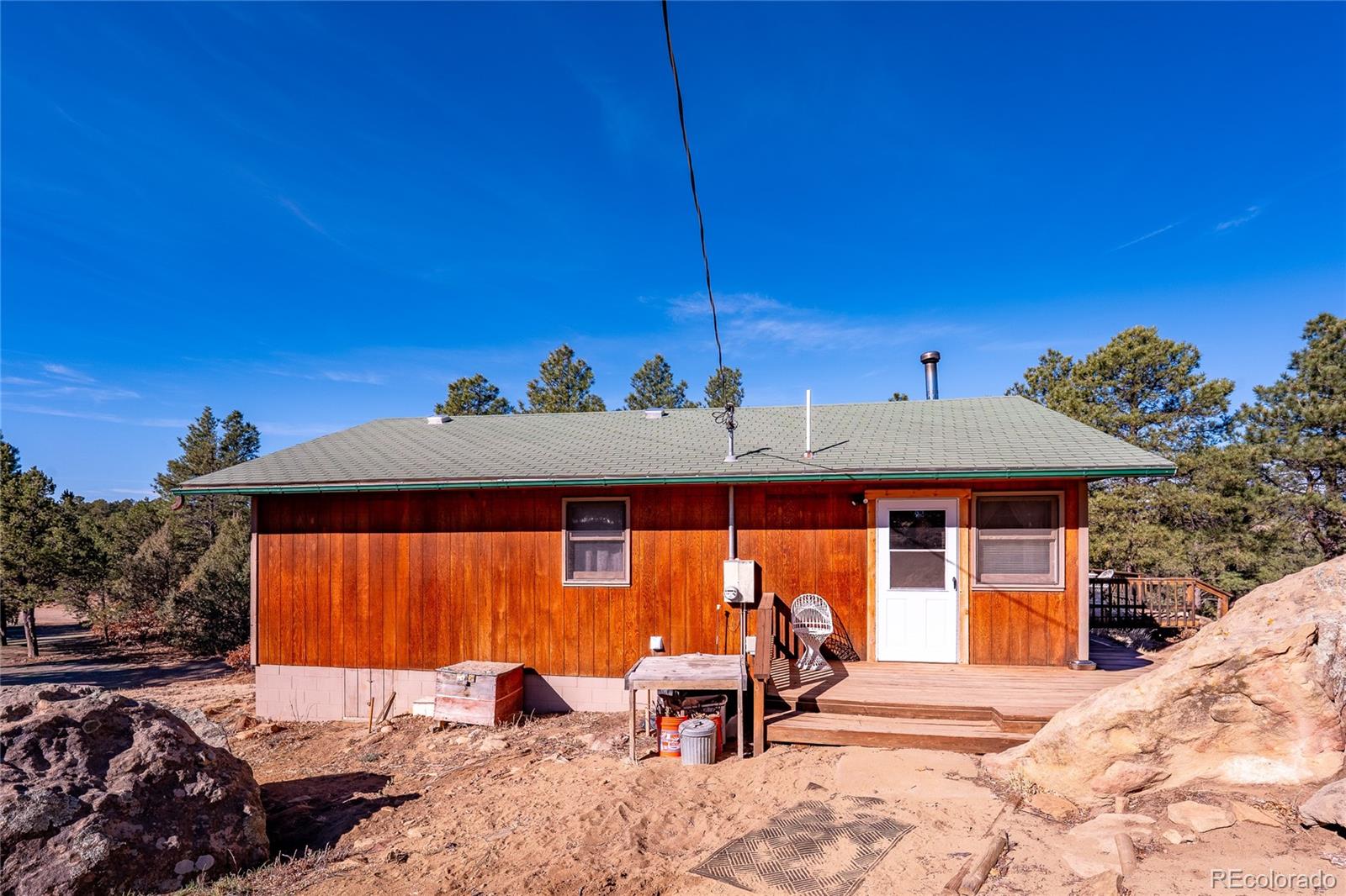 13240 Big Pine Ridge Road Weston, CO 81091 - Photo 29 of 49 a view of a patio with a table and chairs under an umbrella