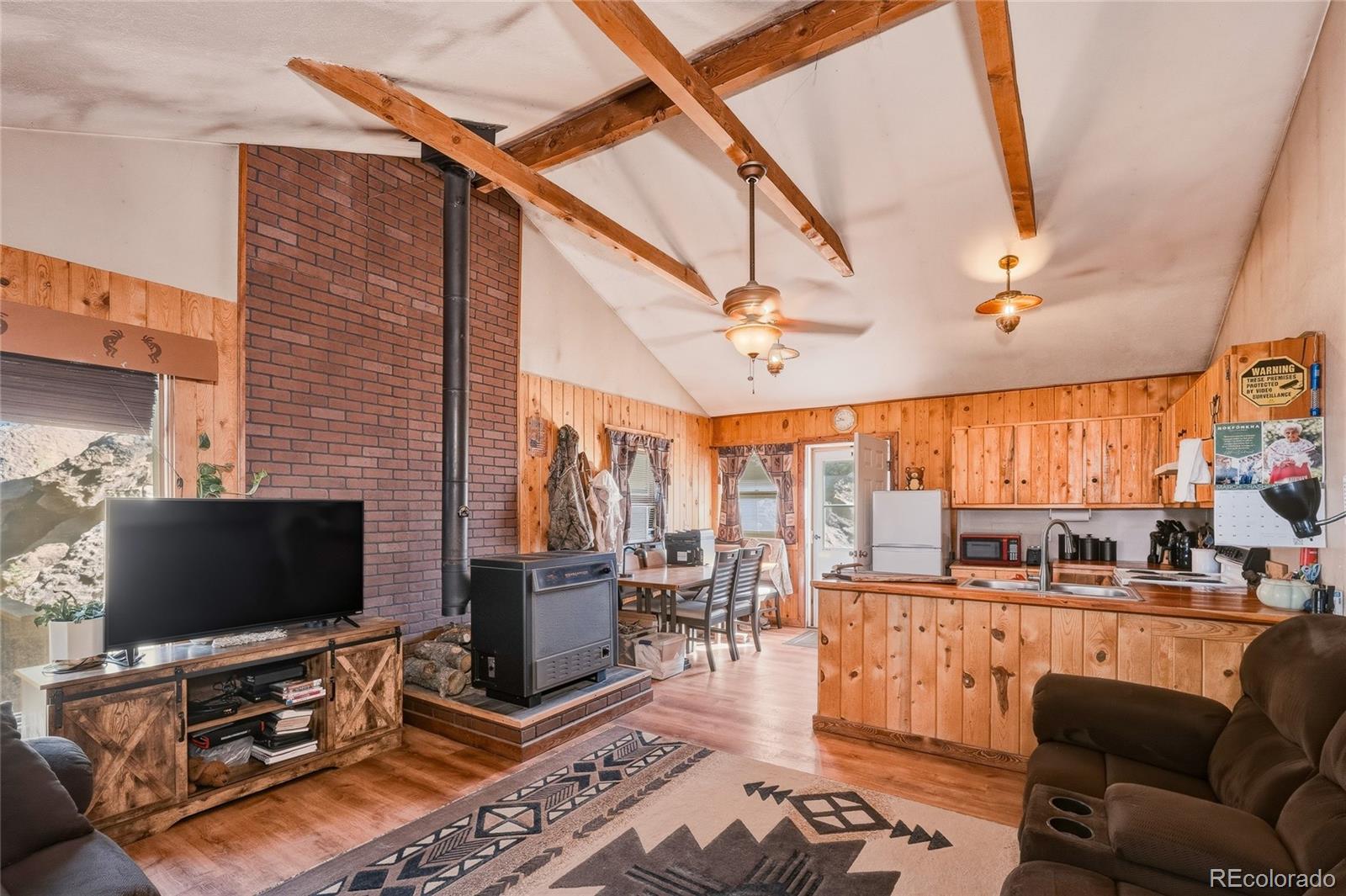 13240 Big Pine Ridge Road Weston, CO 81091 - Photo 4 of 49 a living room with furniture and a flat screen tv