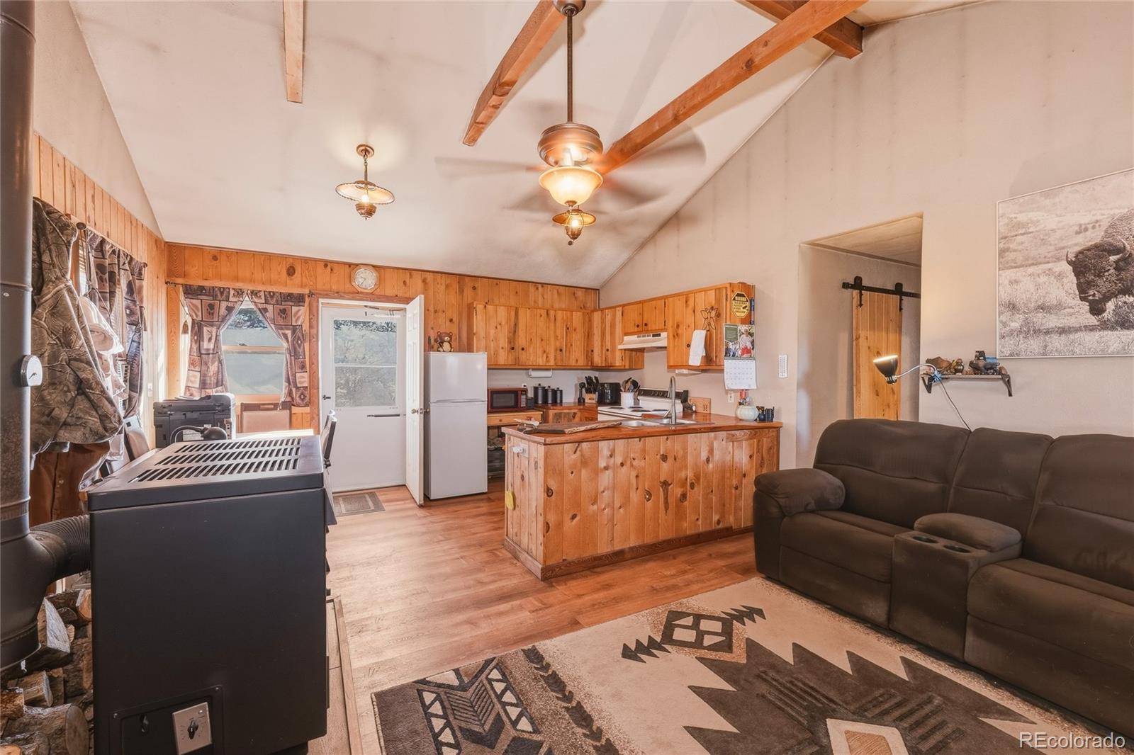 13240 Big Pine Ridge Road Weston, CO 81091 - Photo 5 of 49 a living room with furniture and a large window