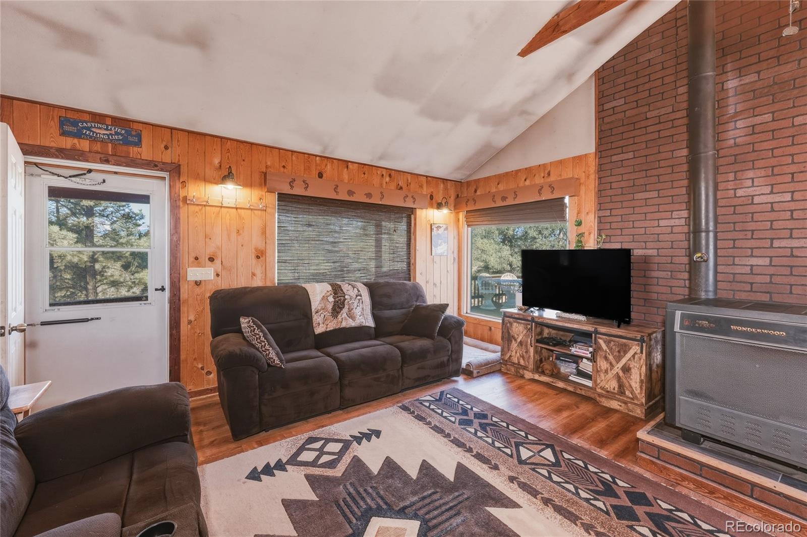 13240 Big Pine Ridge Road Weston, CO 81091 - Photo 7 of 49 a living room with furniture a flat screen tv and a window