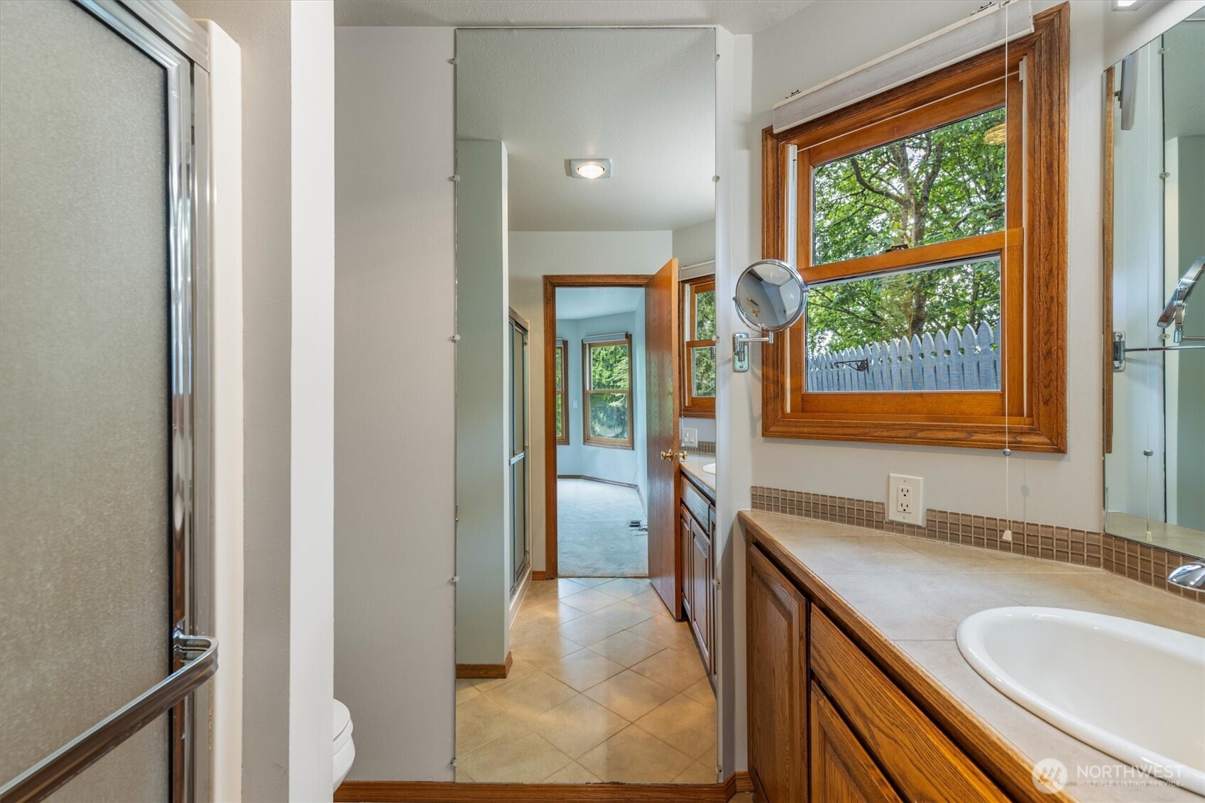 187 Acorn Lane Longview, WA 98632 - Photo 14 of 40 a bathroom with a granite countertop sink and a large mirror