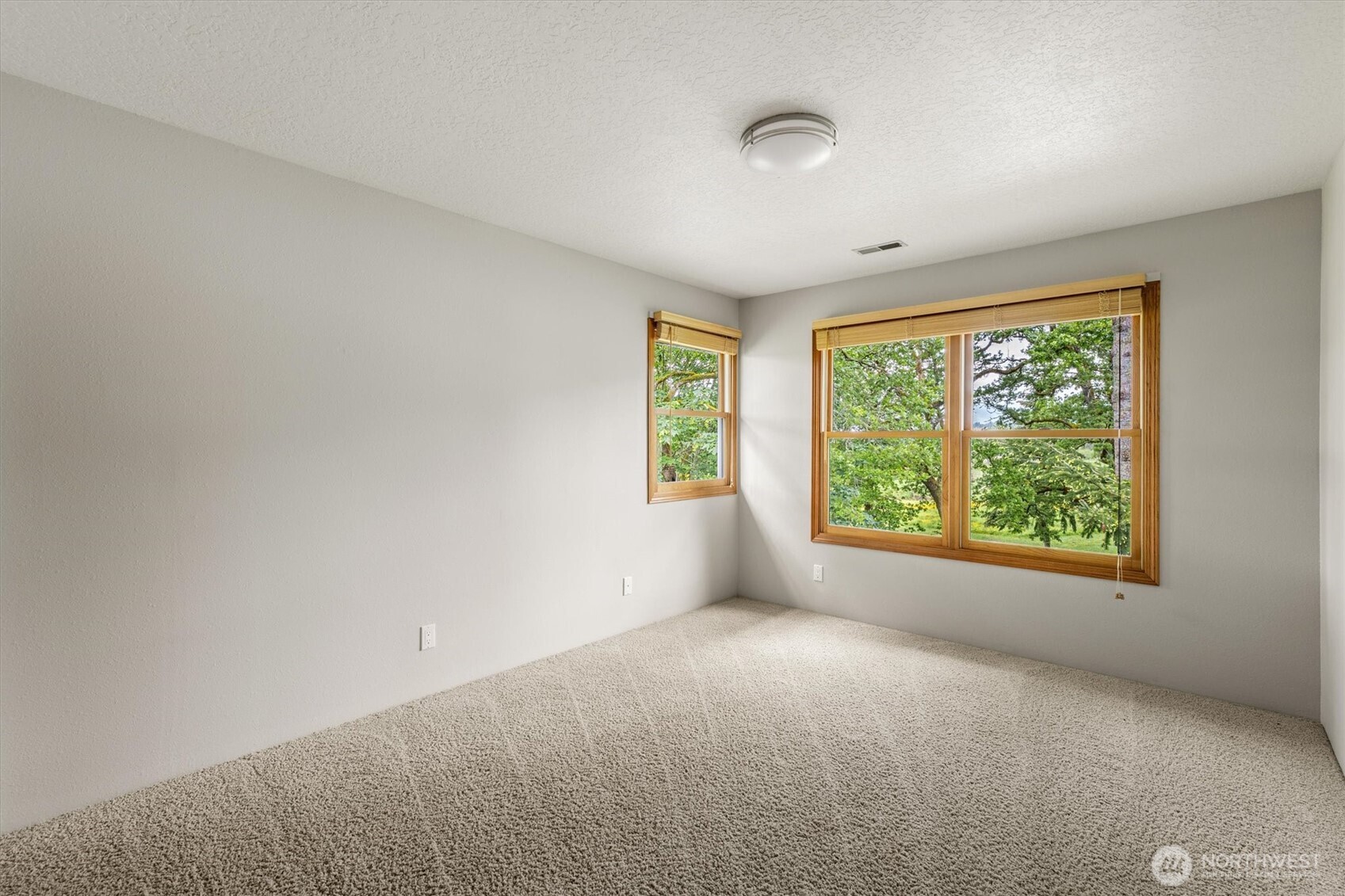 187 Acorn Lane Longview, WA 98632 - Photo 20 of 40 a view of a big room with windows and chandelier fan