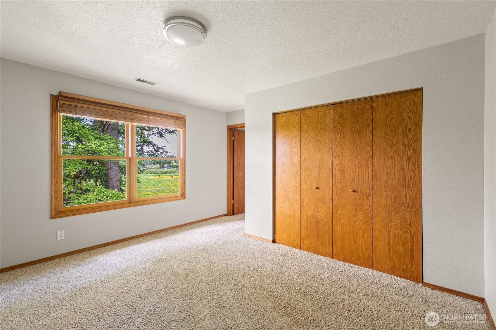 187 Acorn Lane Longview, WA 98632 - Photo 22 of 40 wooden floor in an empty room with a window