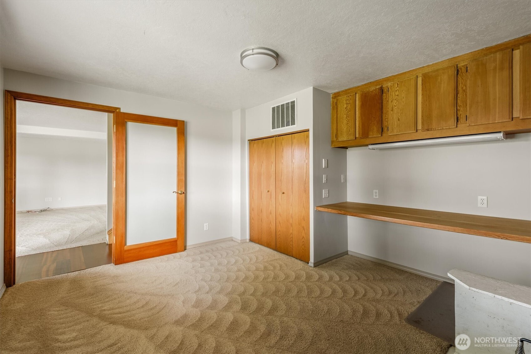 187 Acorn Lane Longview, WA 98632 - Photo 27 of 40 a view of an empty room with window and cabinet