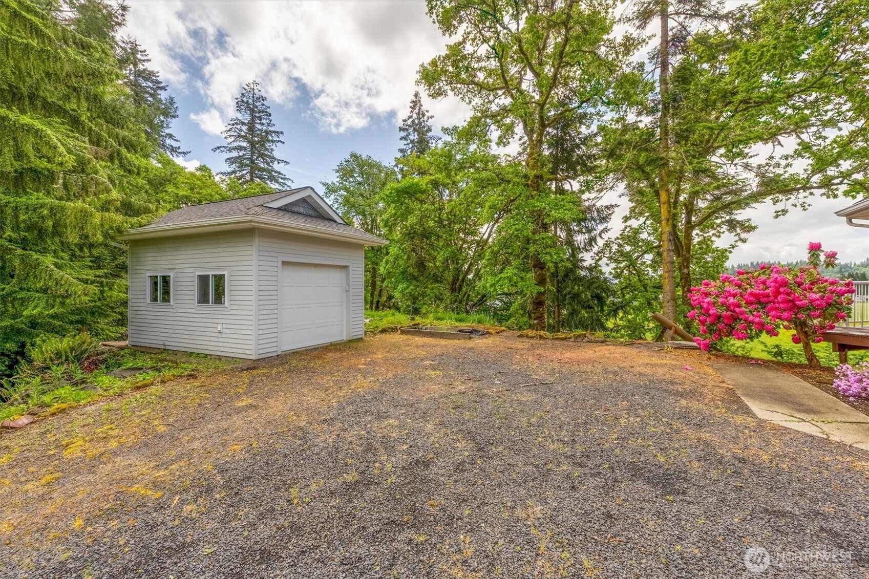 187 Acorn Lane Longview, WA 98632 - Photo 33 of 40 a yellow house with trees in front of it