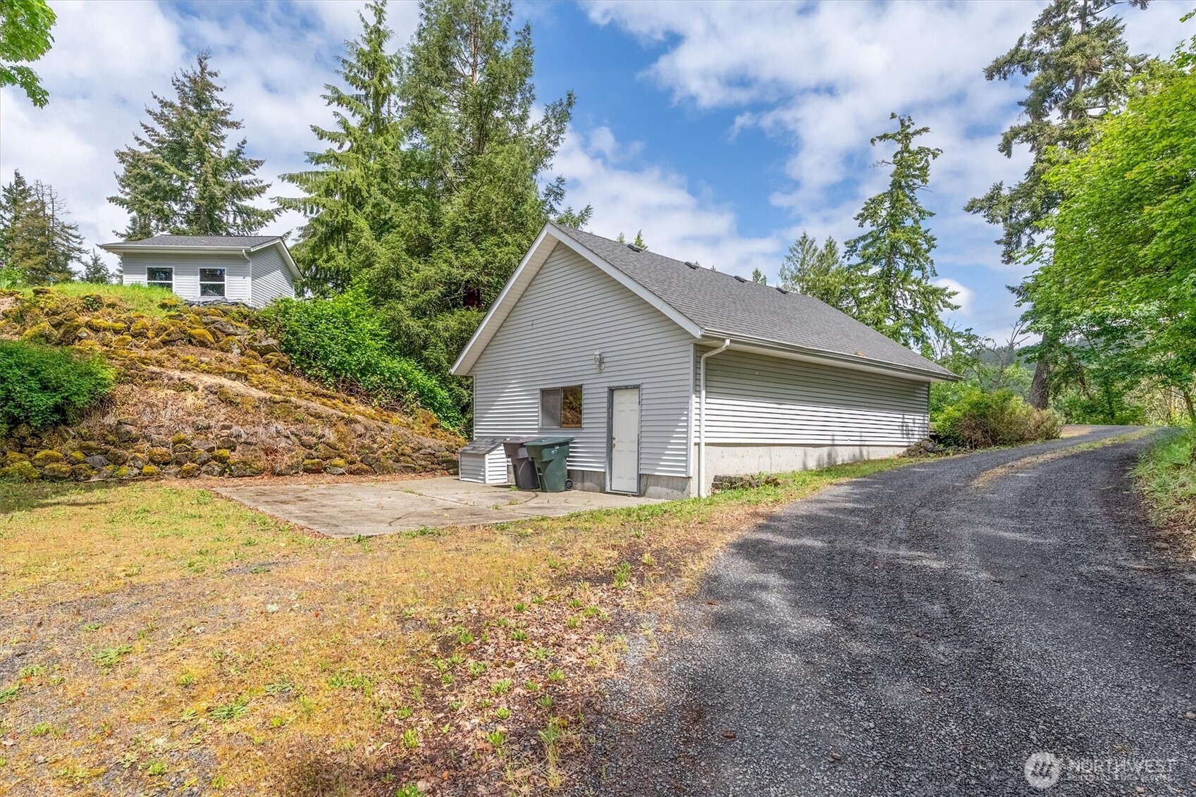 187 Acorn Lane Longview, WA 98632 - Photo 36 of 40 a view of a house with a yard and garage