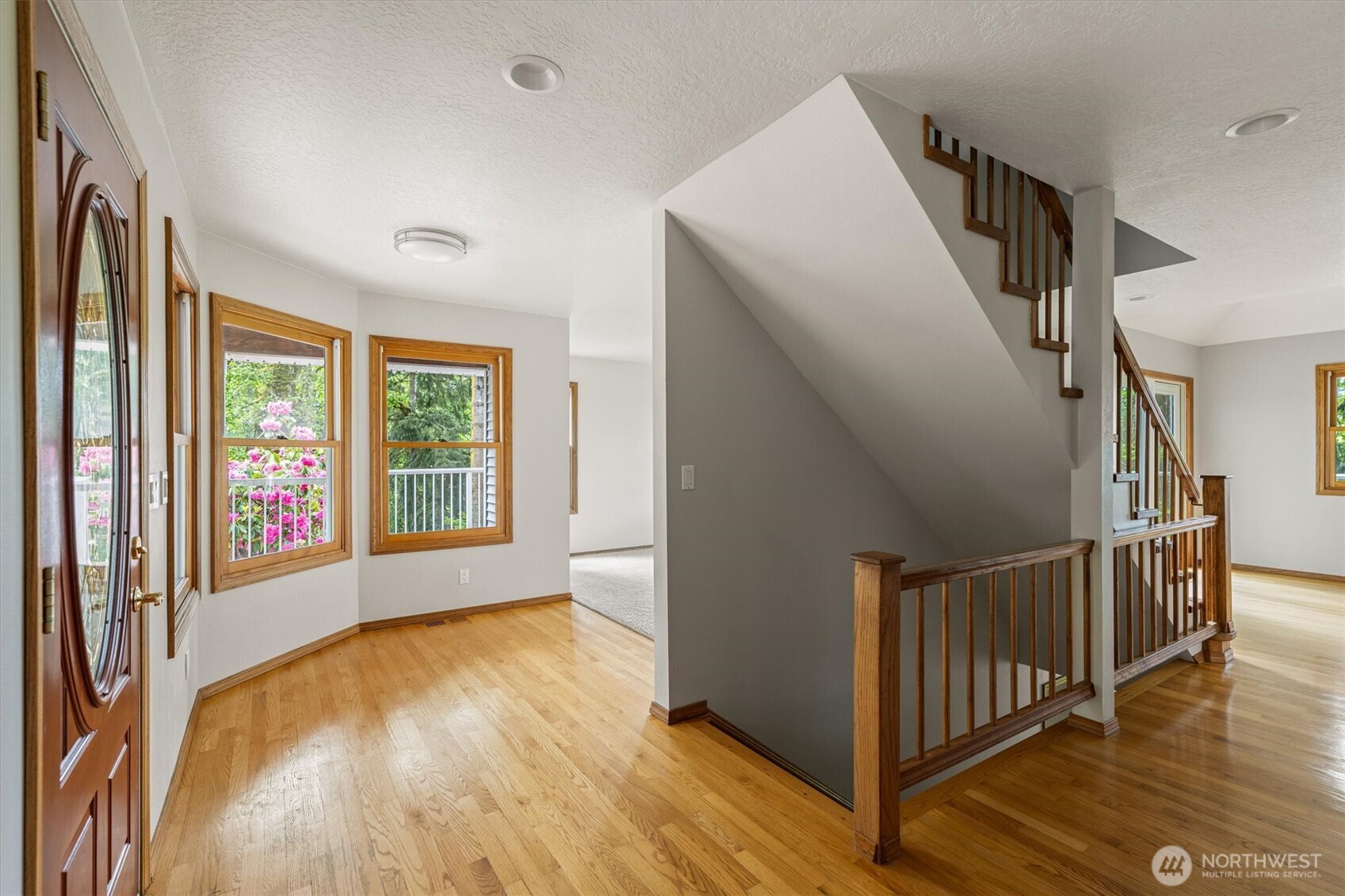 187 Acorn Lane Longview, WA 98632 - Photo 4 of 40 a view of an empty room with wooden floor and a window