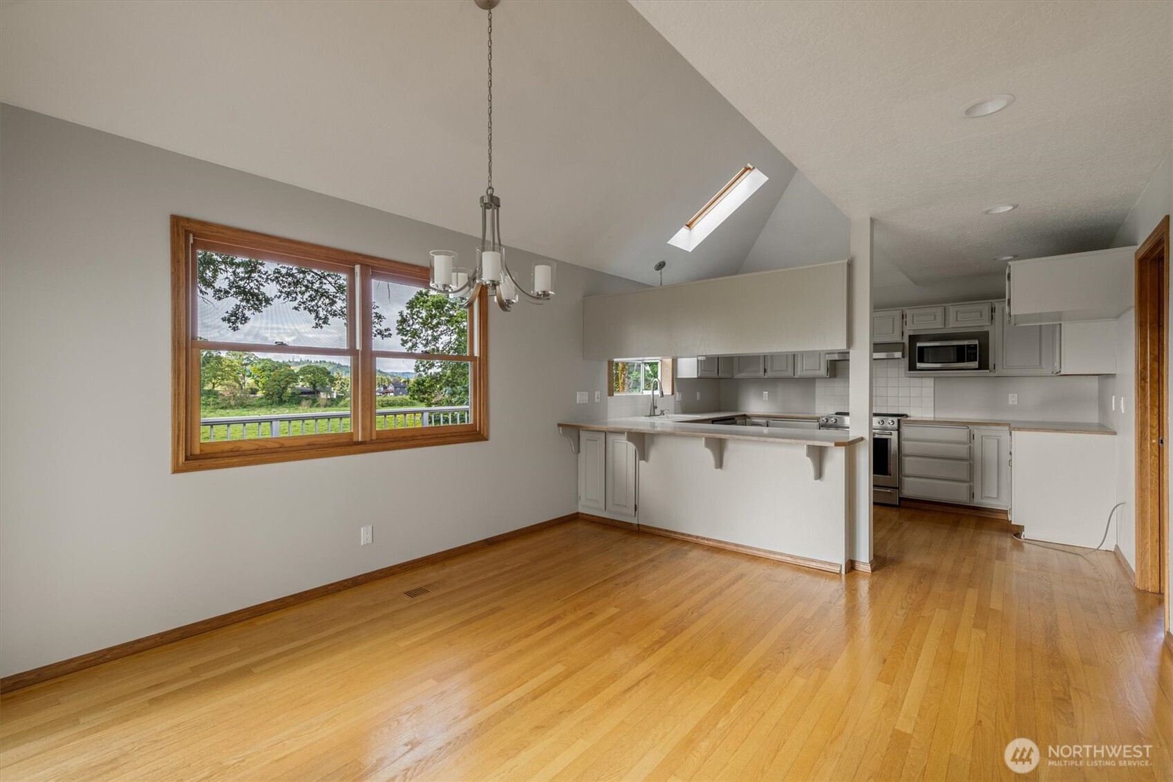 187 Acorn Lane Longview, WA 98632 - Photo 6 of 40 a view of kitchen with wooden floor and window