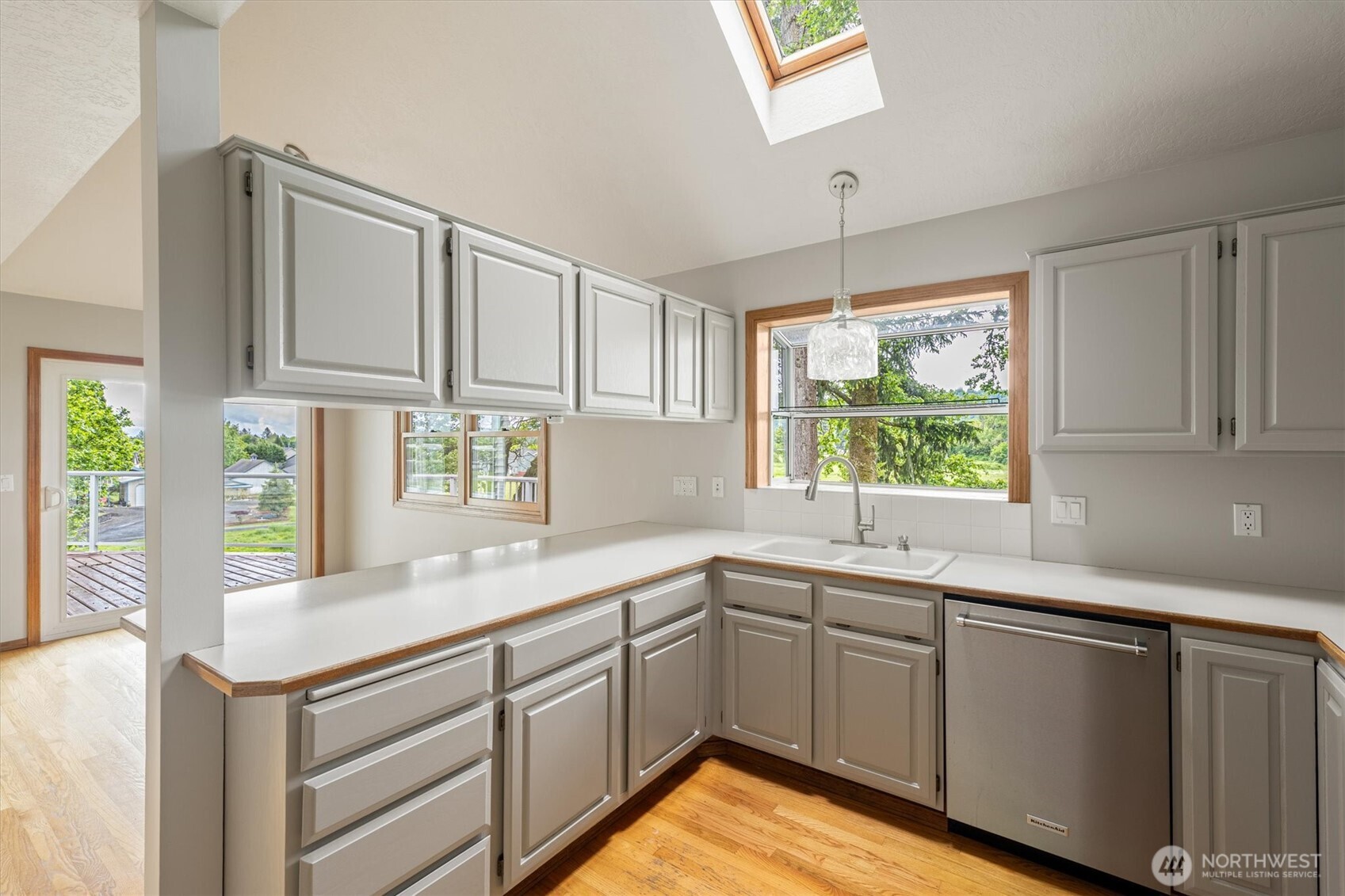 187 Acorn Lane Longview, WA 98632 - Photo 10 of 40 a kitchen with a sink window and cabinets