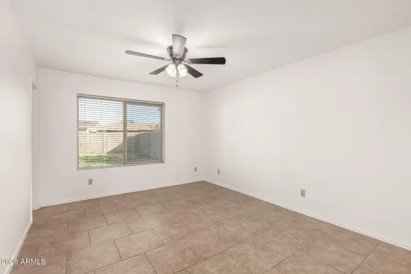 a bathroom with a granite countertop toilet sink and mirror