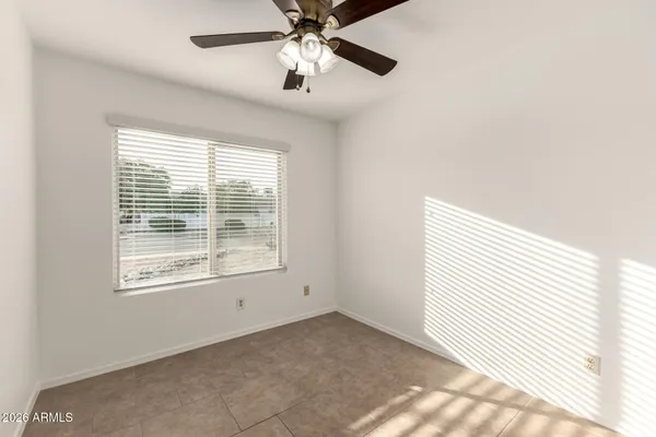 a kitchen with a sink cabinets and a window