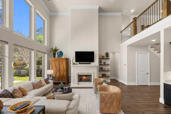 a kitchen with stainless steel appliances white cabinets and stove top oven