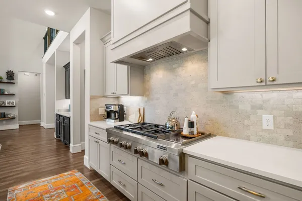 a spacious bathroom with a sink double vanity and a mirror