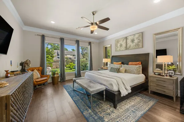 a bedroom with a bed and a couch