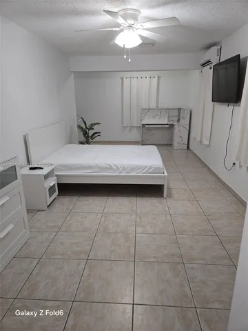 a living room with a couch and a flat screen tv