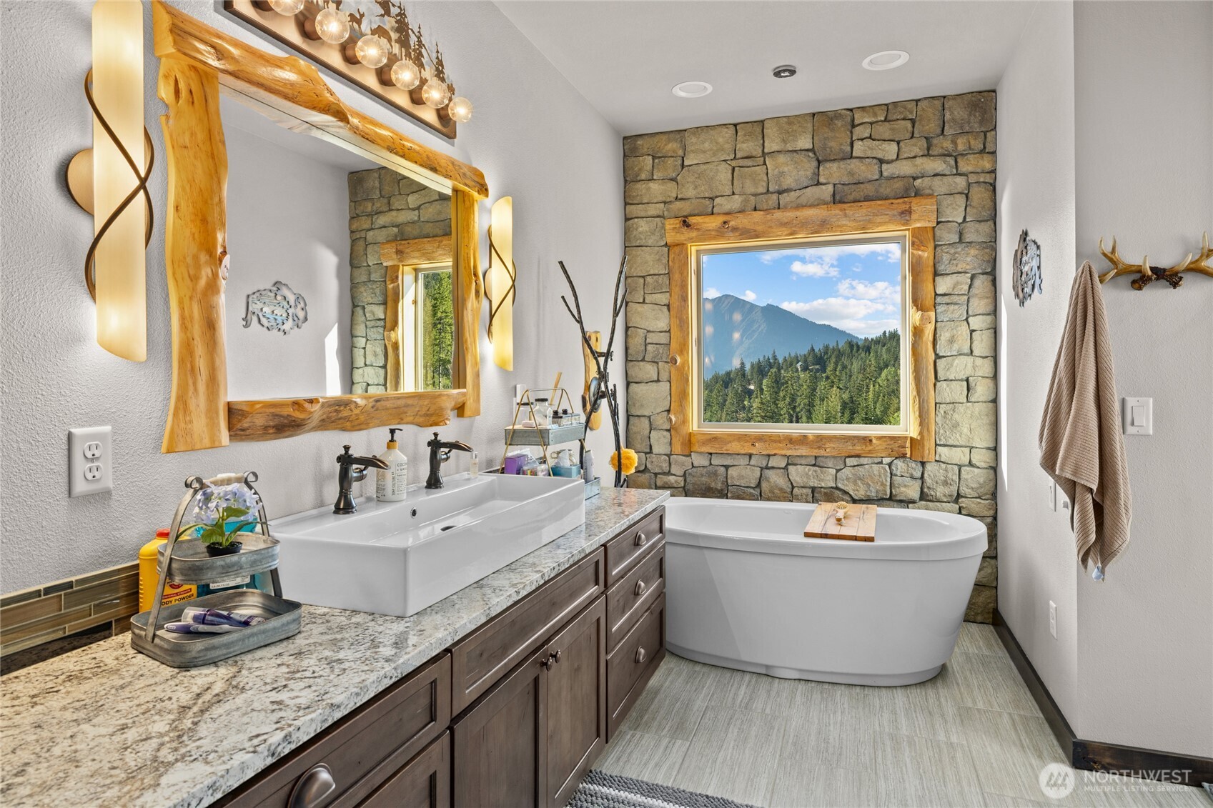 1481 Morgan Creek Road Ronald, WA 98940 - Photo 18 of 40 a bathroom with a granite countertop tub sink and mirror