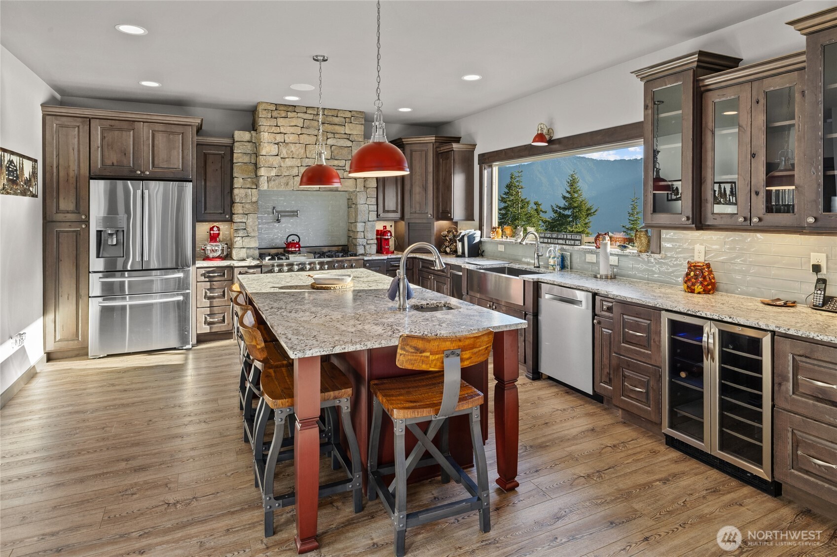 1481 Morgan Creek Road Ronald, WA 98940 - Photo 9 of 40 a kitchen with stainless steel appliances granite countertop a kitchen island hardwood floor sink stove dining table and chairs