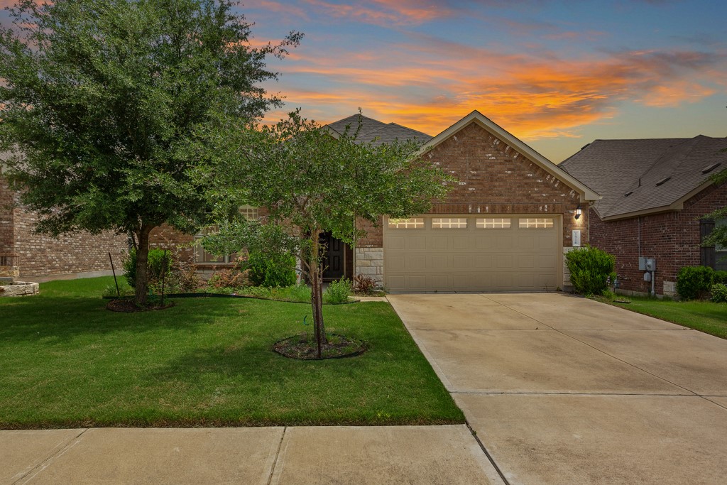 1916 Elaina Loop Leander, TX 78641 - Photo 1 of 23 a front view of a house with a yard