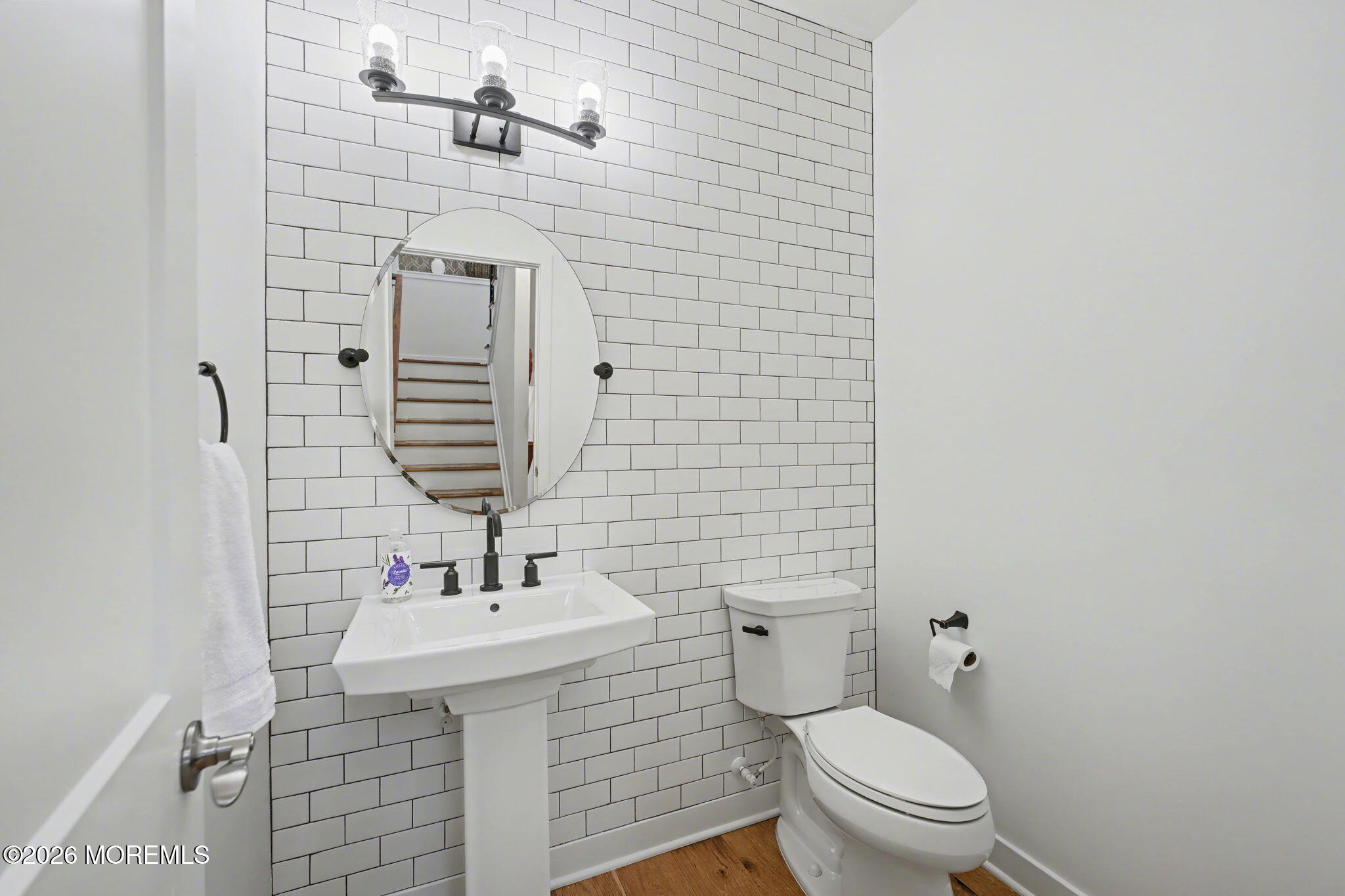 25 Catherine Street, Unit 15 Red Bank, NJ 07701 - Photo 12 of 21 a bathroom with a sink a toilet and shower