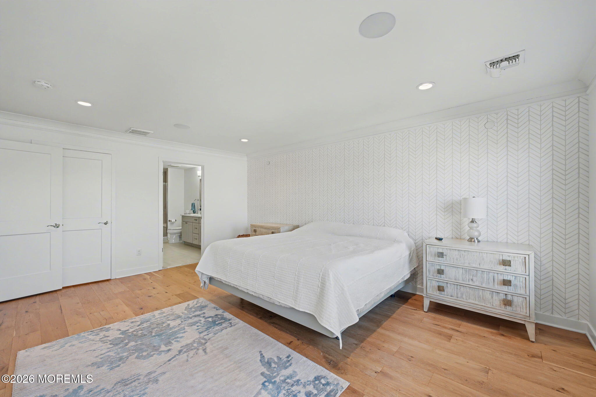 25 Catherine Street, Unit 15 Red Bank, NJ 07701 - Photo 14 of 21 a spacious bedroom with a bed and a couch