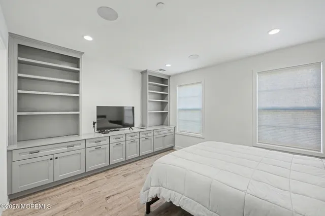 a bedroom with a bed and furniture