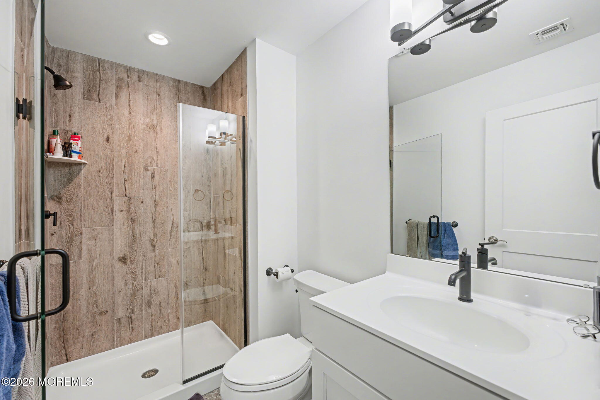 25 Catherine Street, Unit 15 Red Bank, NJ 07701 - Photo 4 of 21 a bathroom with a sink a toilet and shower
