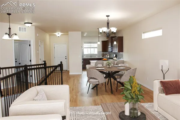 a view of a room with wooden floor