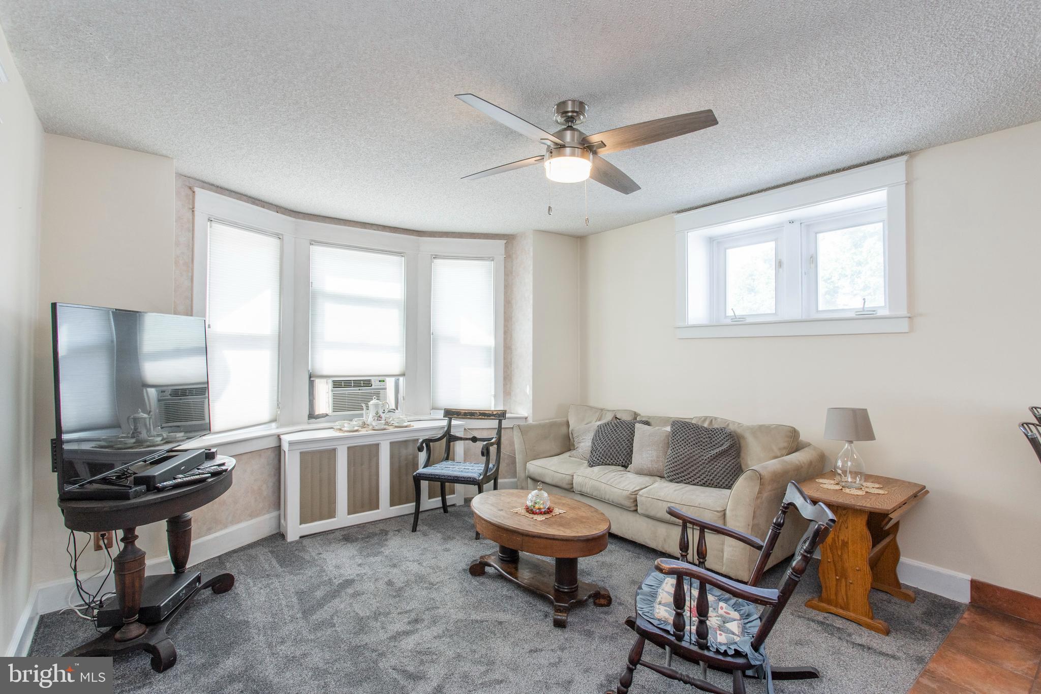 7212 Wayne Avenue Upper Darby, PA 19082 - Photo 8 of 20 Family room w/ new carpet and lots of light