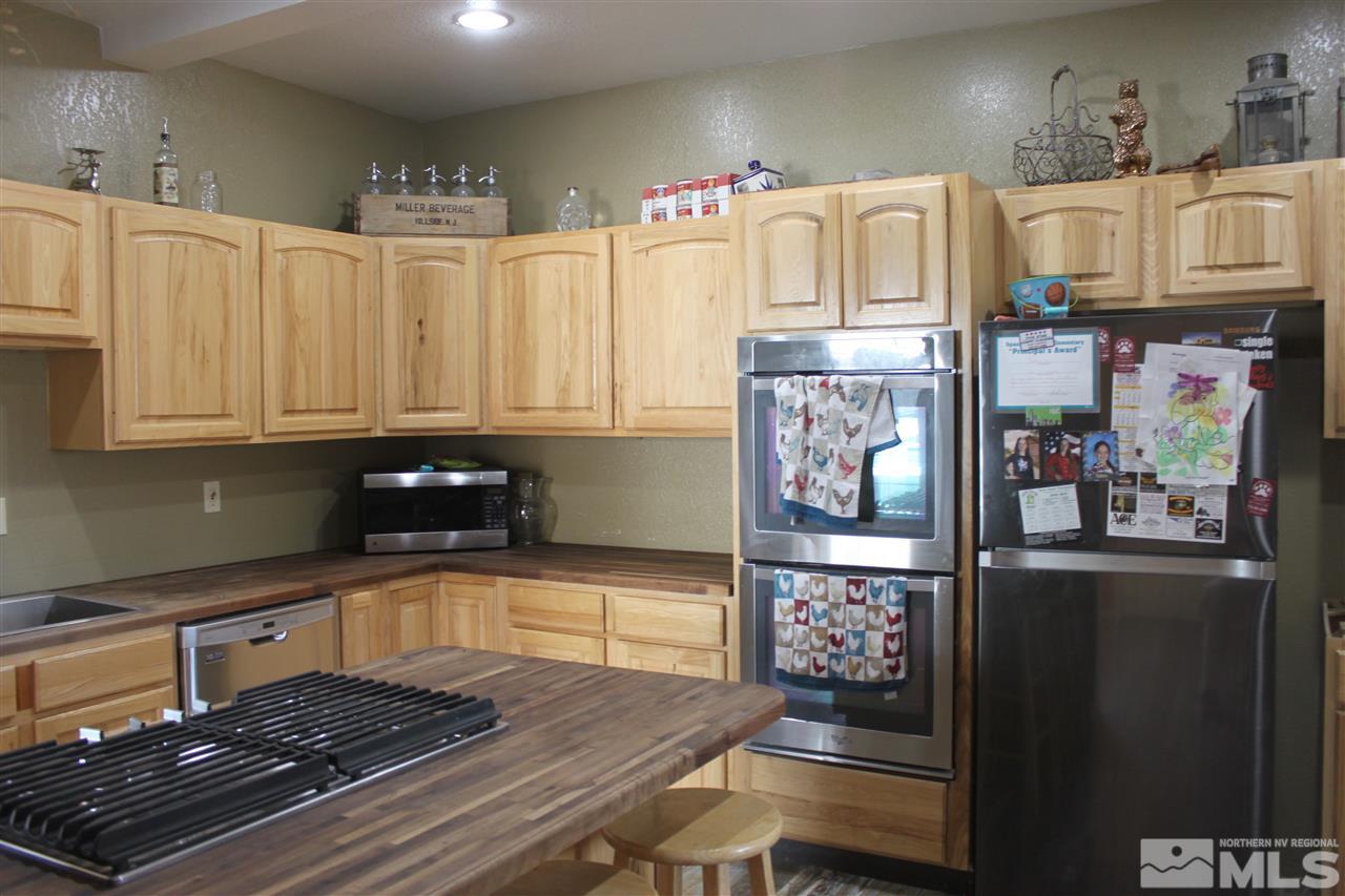 2000 Piute Creek Road Reno, NV 89510 - Photo 7 of 17 a kitchen with lots of counter space and wooden floor