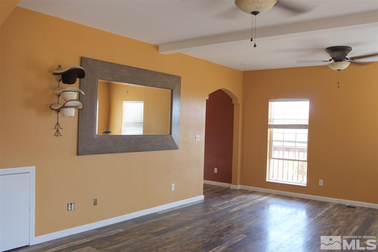 2000 Piute Creek Road Reno, NV 89510 - Photo 9 of 17 a view of an empty room with wooden floor and a window