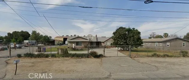 a view of a chairs and table in a patio