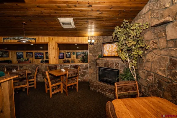 a kitchen with stainless steel appliances kitchen island granite countertop a refrigerator and a stove