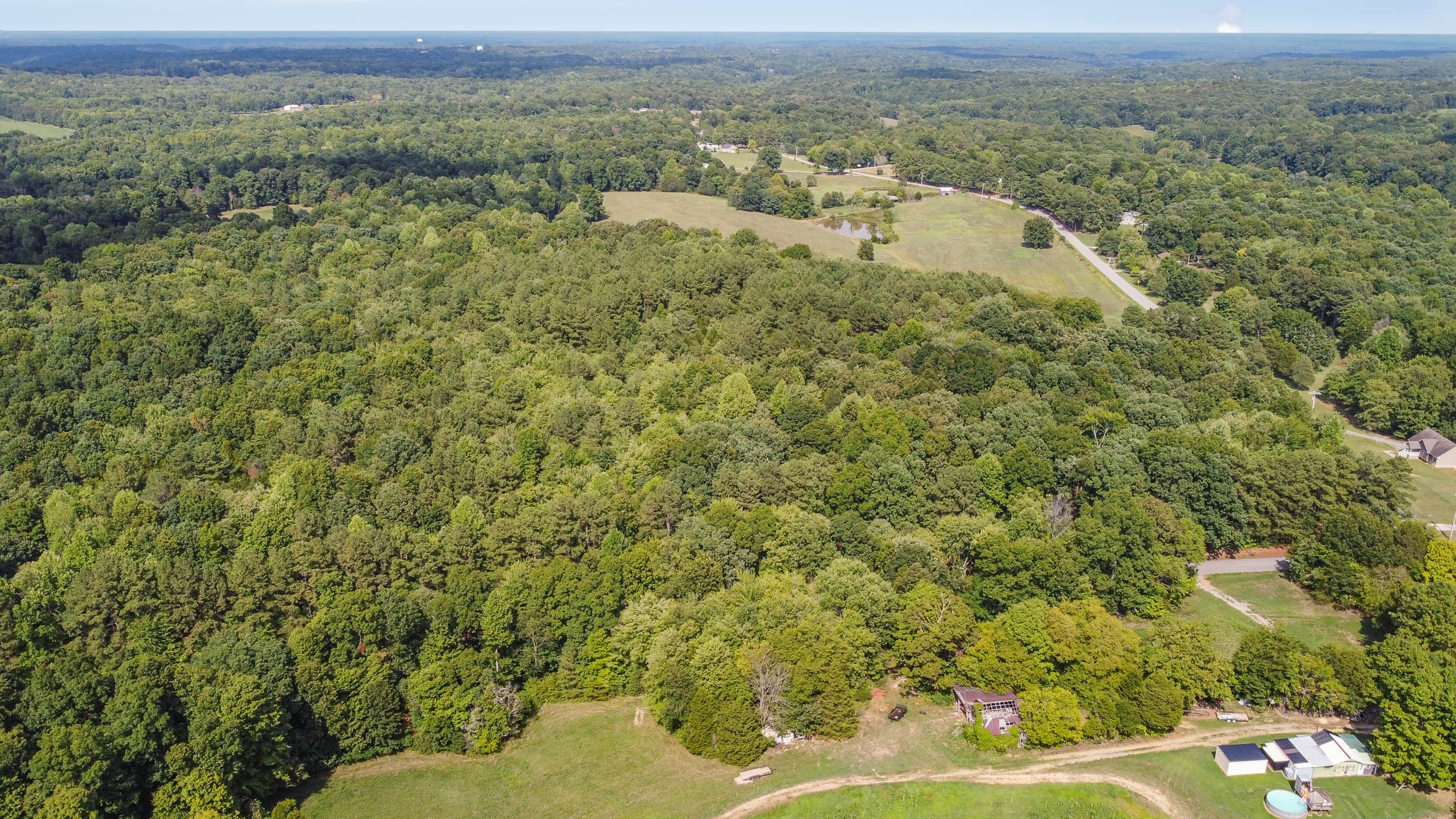 2111 Moorefield Road Cunningham, TN 37052 - Photo 7 of 13 a view of a field with an outdoor space and seating