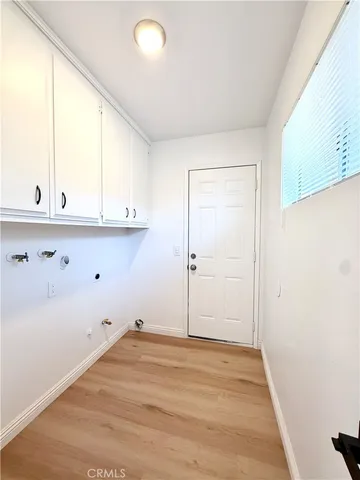 a view of cabinets and wooden floor